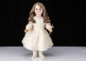 A bisque headed child doll impressed 8,