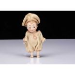 A small German all-bisque googly eyed doll,