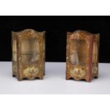 A pair of French lithographed tinplate and wooden doll’s display cabinets,