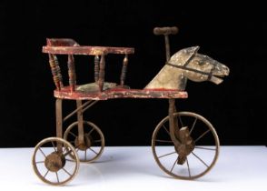 A carved and painted wooden horse tricycle circa 1900,