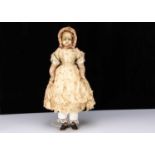 A large 19th century English poured wax child doll,