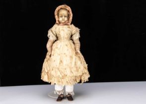 A large 19th century English poured wax child doll,
