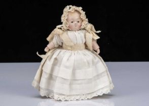 A small mid 19th century papier-mâché Taufling baby,