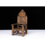 A dolls’ 17th century style inlaid Wainscot armchair,