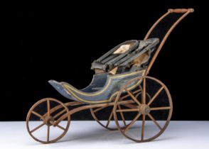 A 19th century three-wheeled dolls’ pushchair,