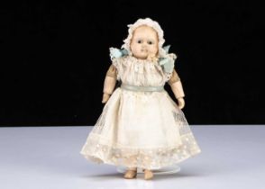 A small mid 19th century papier-mâché Taufling baby,