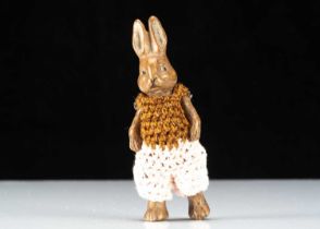 A Hertwig all-bisque dolls’ house rabbit boy doll,