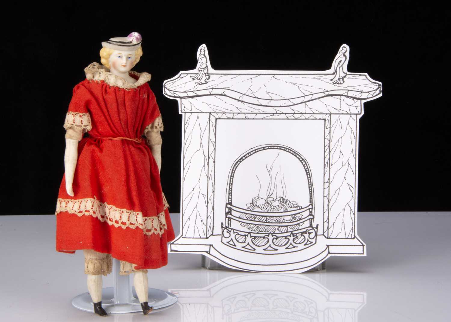 A rare small 19th century bisque shoulder-head doll with moulded hat,