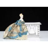 An 19th century beautifully dressed bisque shoulder head dolls’ house doll,