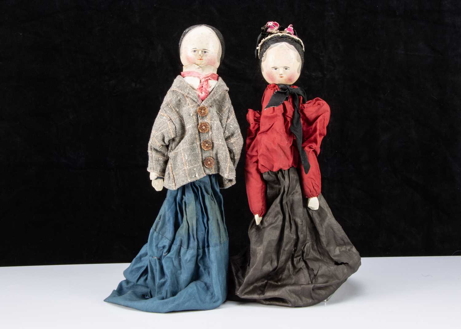 An unusal late 19th century German pegged wooden type hand puppet couple,