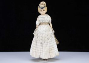 A rare German 19th century wax over composition shoulder head doll with moulded hat,