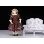 A small French pressed bisque shoulder-head fashionable doll 1860s,