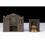 An Evans & Cartwright tinplate dolls’ house range and fireplace,