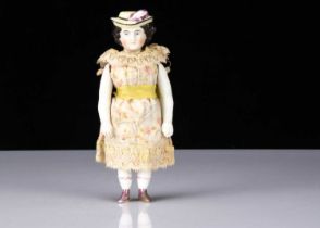 A rare 19th century bisque shoulder-head doll with moulded hat,