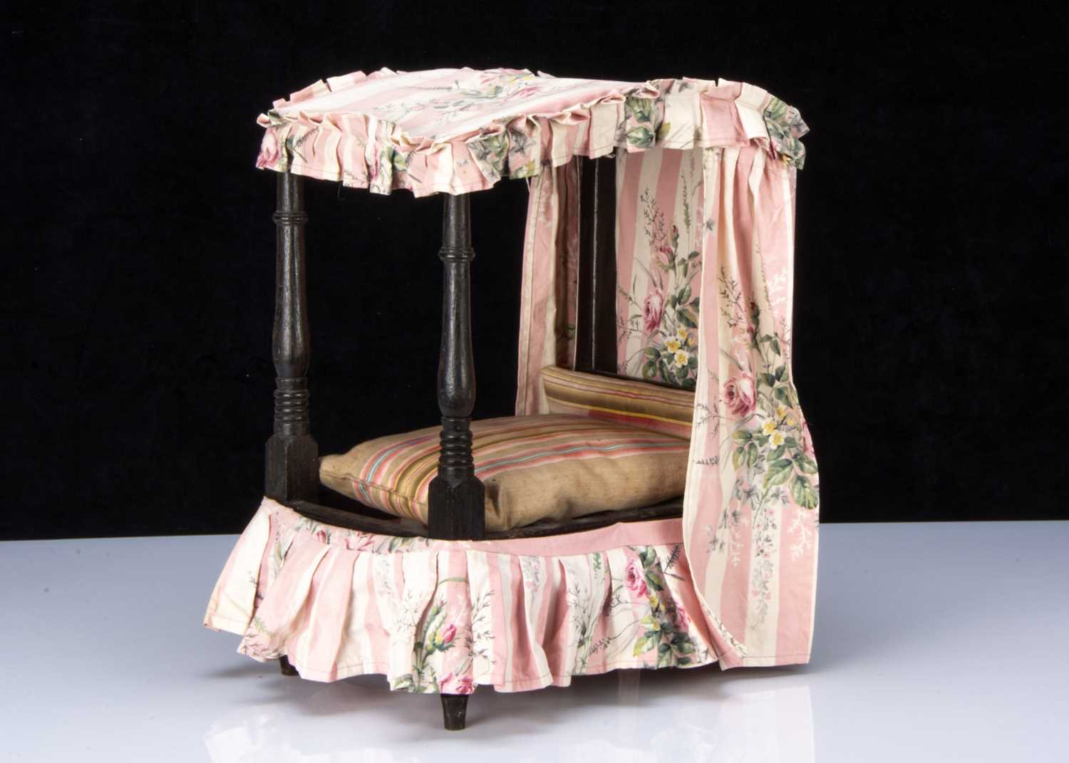 A 19th century English dolls’ tester bed,