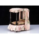 A 19th century English dolls’ tester bed,