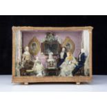 A second half of the 19th century room setting with bisque shoulder head dolls,