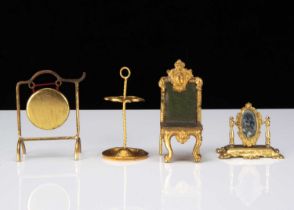 Four German gilt metal dolls’ house items,