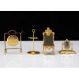 Four German gilt metal dolls’ house items,