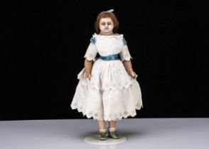 A 19th century English poured wax child doll,