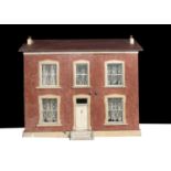 An English painted wooden dolls’ house circa 1900,