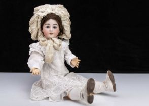 A large German bisque headed doll embossed with I,