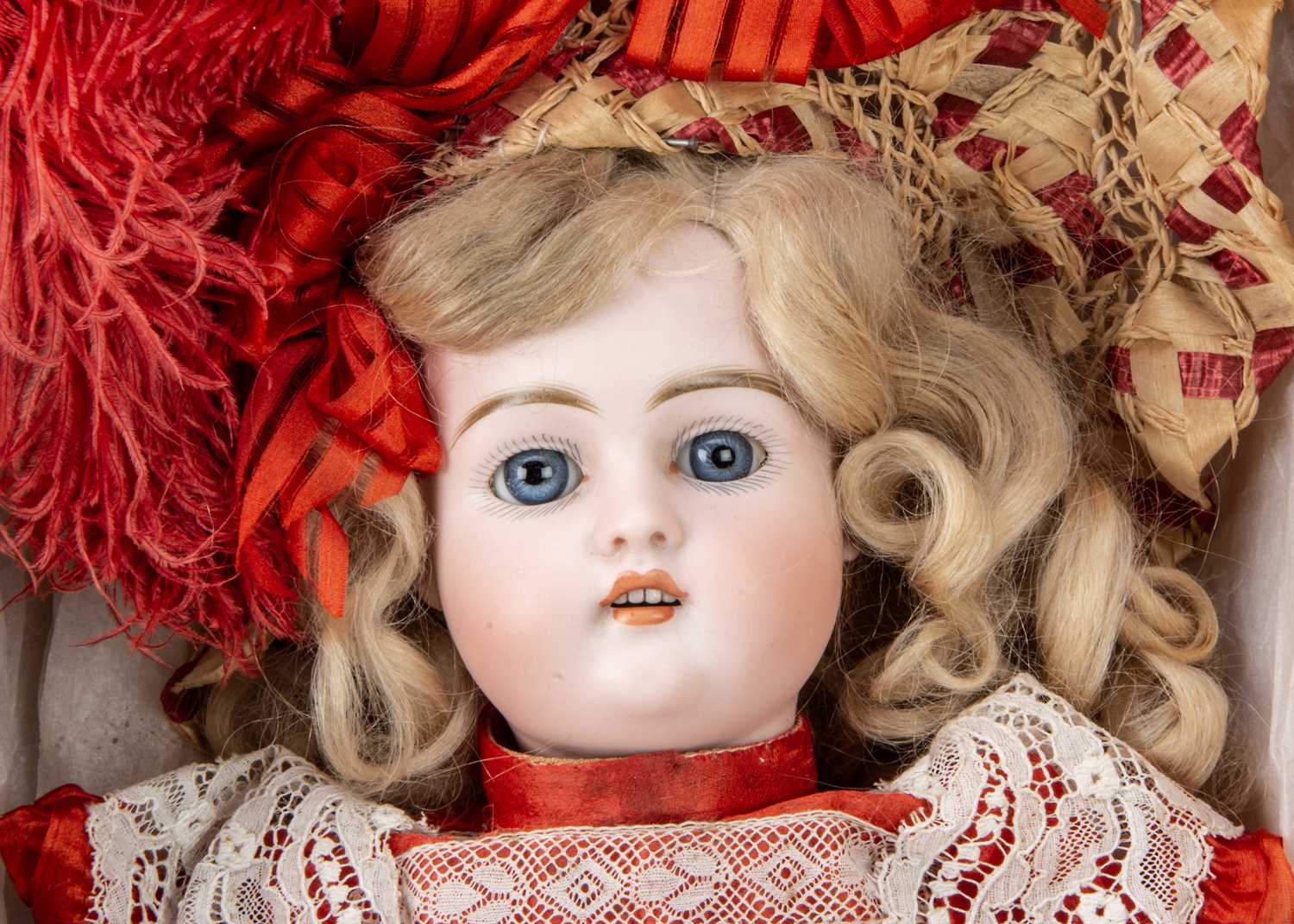 A German 457 bisque head doll in factory dress and box base, - Image 3 of 3