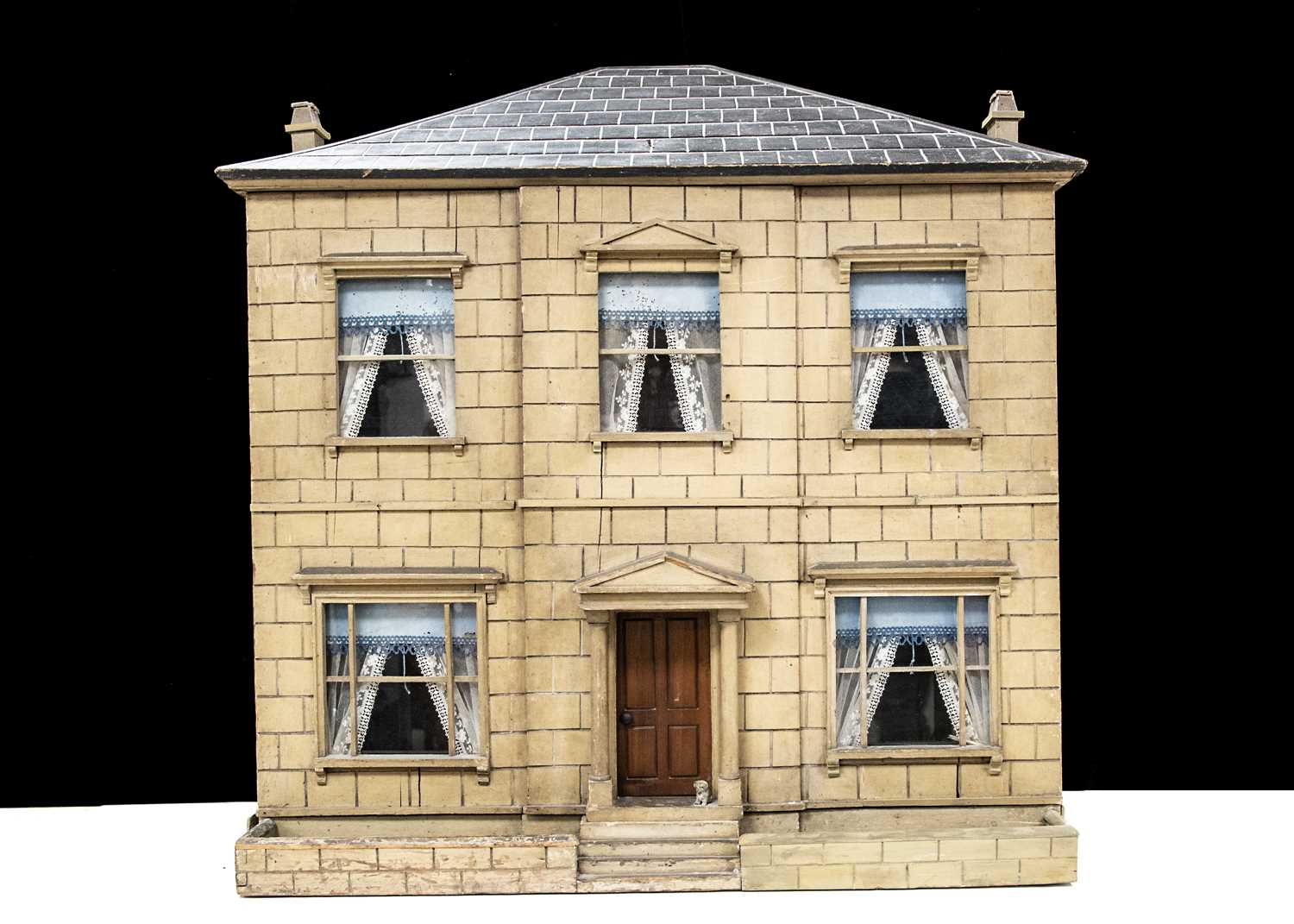A mid 19th century English Toyman’s wooden dolls’ house,