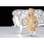 A French all-bisque swivel head dolls’ house doll,