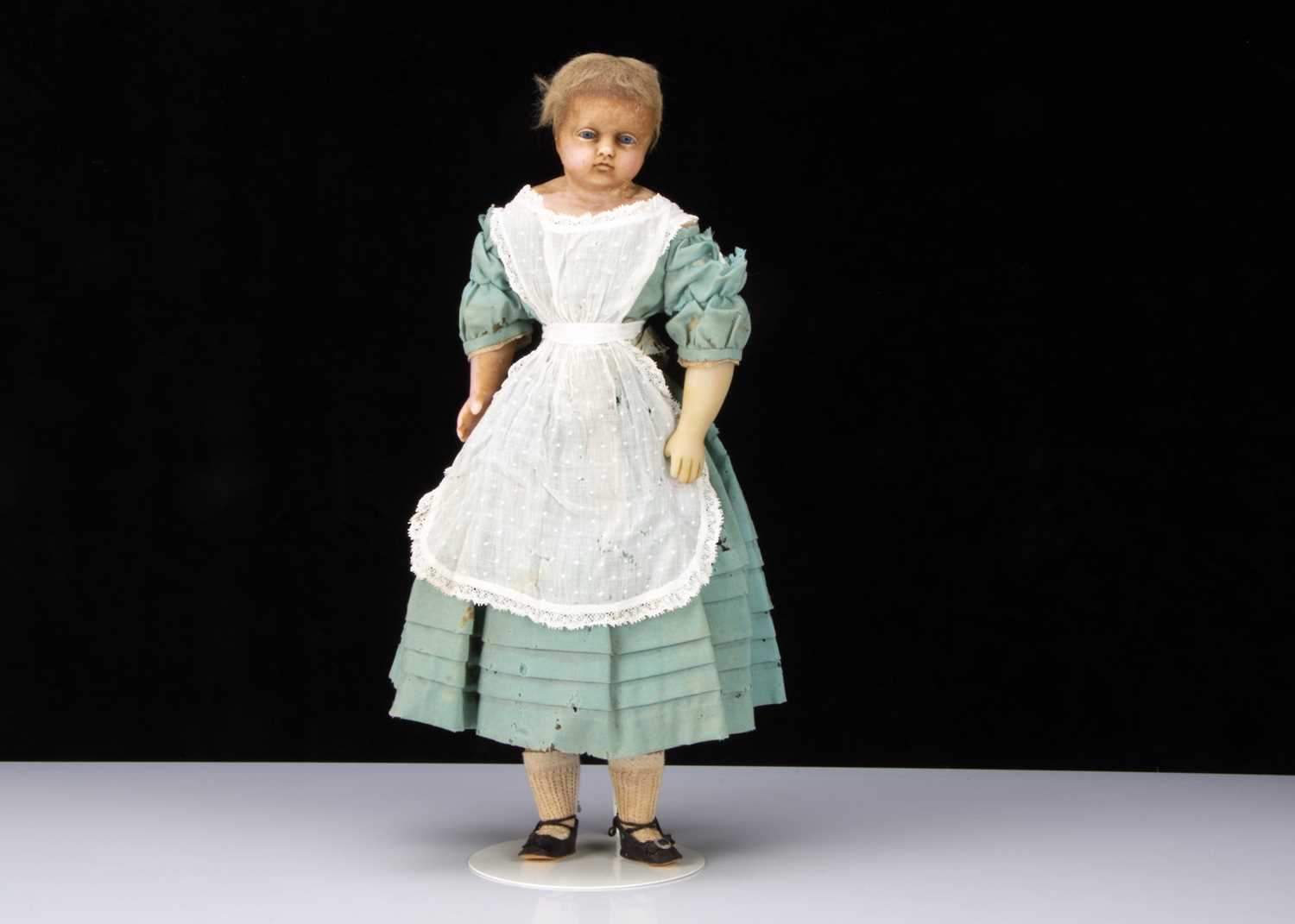 A mid 19th century English poured wax child doll,