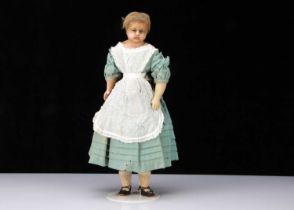 A mid 19th century English poured wax child doll,