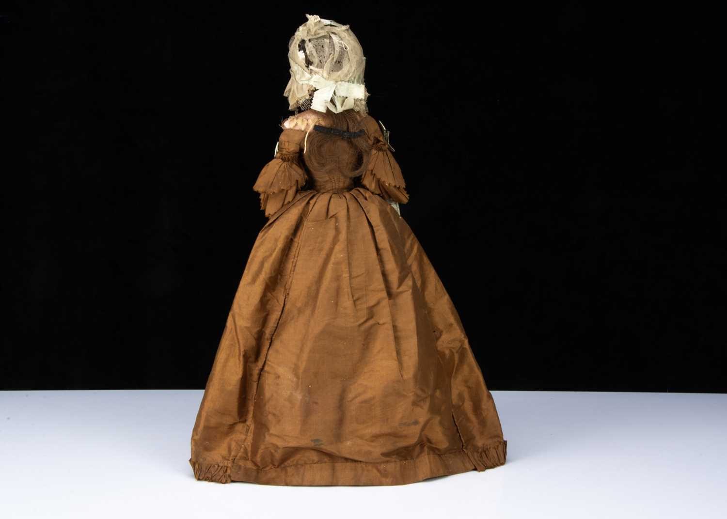 An English early 19th century wax over papier-mâché doll in rare 18th century style silk open robe, - Image 2 of 2