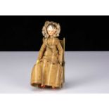 A small early 19th century Grodnerthal carved wooden doll,