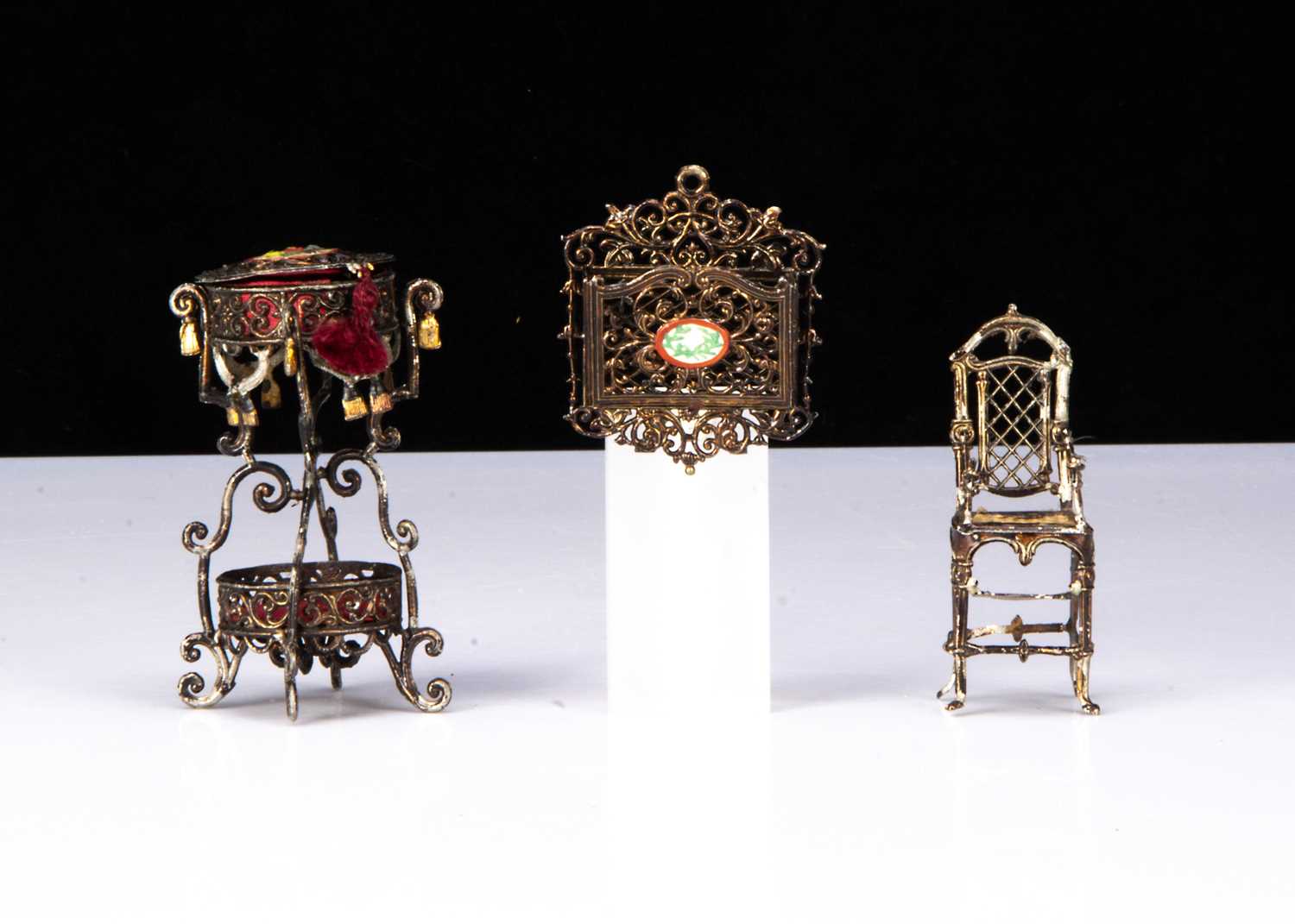 Three German bronzed soft metal dolls’ house chattels,