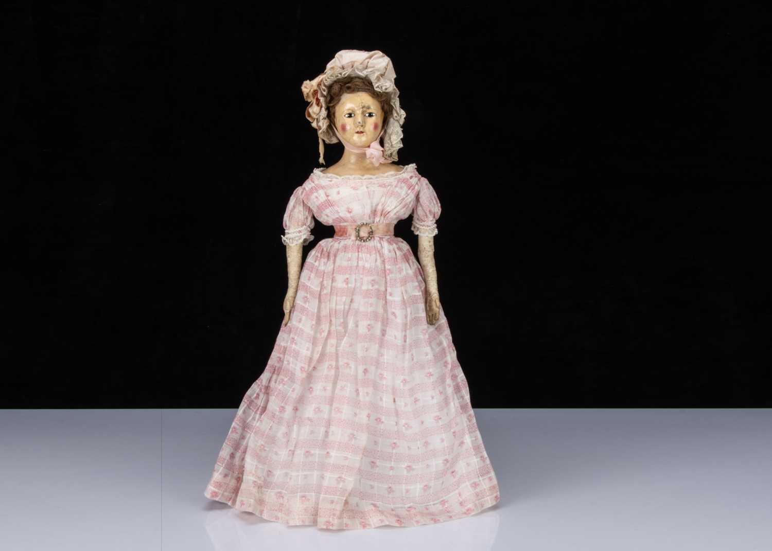 A rare early 19th century English papier-mâché shoulder-head doll,