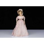 A rare early 19th century English papier-mâché shoulder-head doll,
