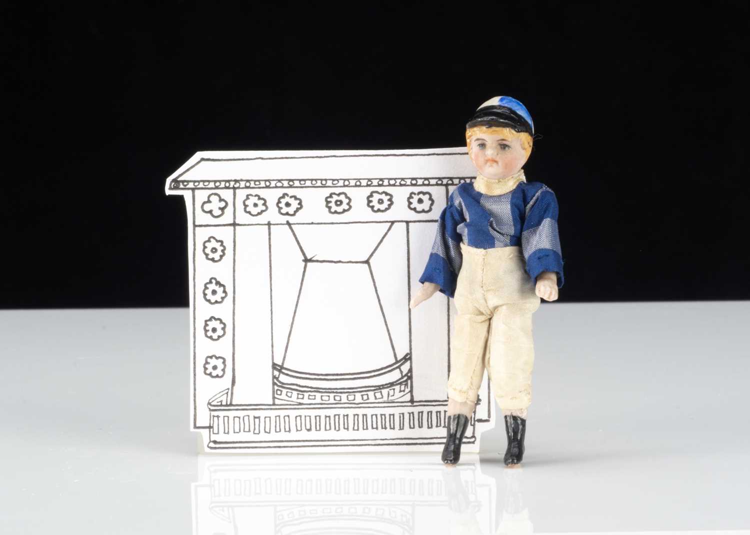 An all-bisque dolls’ house jockey,