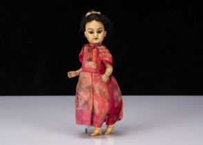 A small German Asian child doll,