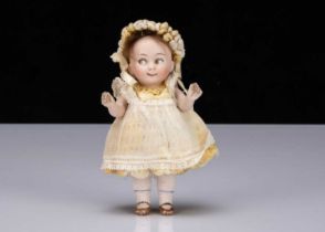 A small German all-bisque googly eyed doll marked 292,