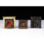 Three 19th century painted tinplate dolls’ house fireplaces,