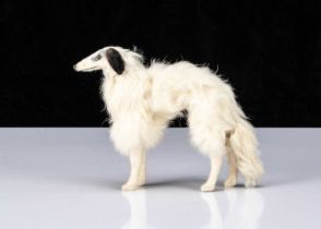 A German fur covered Borzoi dog suitable companion for a fashionable doll,