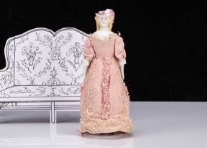 A rare 19th century small German bisque shoulder-head lady doll with moulded hat,