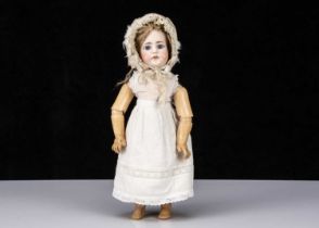 A late 19th century German bisque headed doll impressed 51-7,