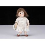 A small Kestner all-bisque 112 googly eyed girl doll,