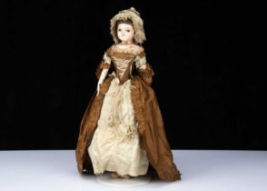 An English early 19th century wax over papier-mâché doll in rare 18th century style silk open robe,