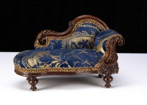 A late 19th century doll’s chaise longue,