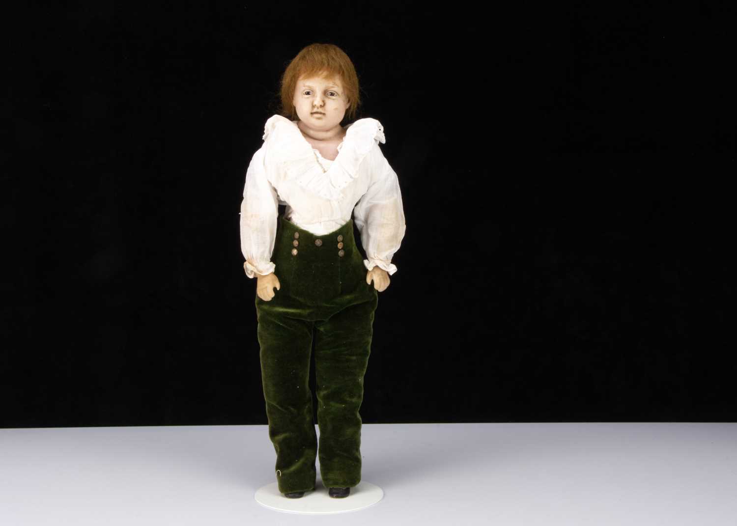 An unusual mid 19th century English poured wax boy doll,