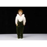 An unusual mid 19th century English poured wax boy doll,