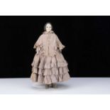 A very rare mid 19th century gutta percha shoulder head doll with glass eyes,