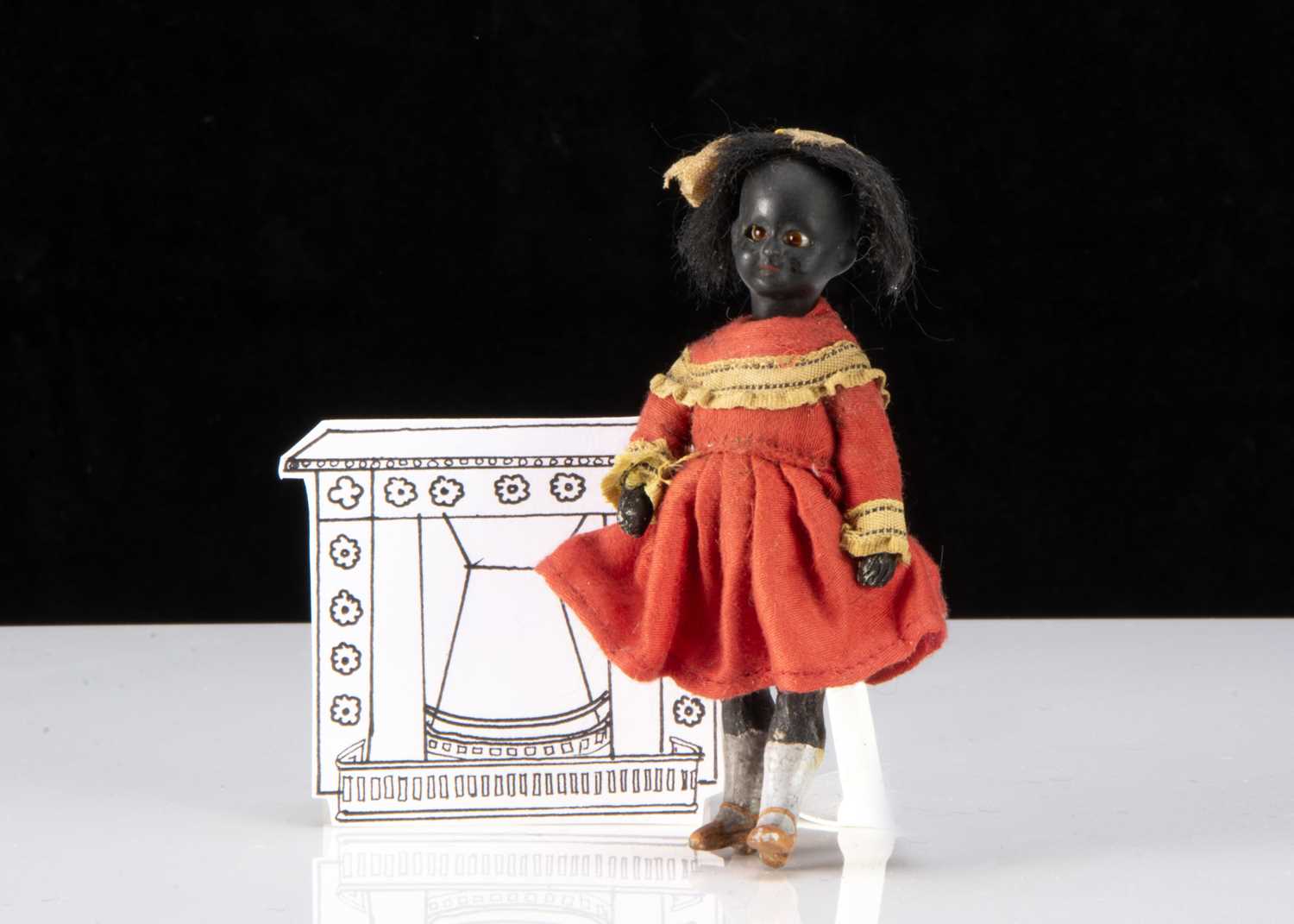 A German black swivel head dolls’ house doll,